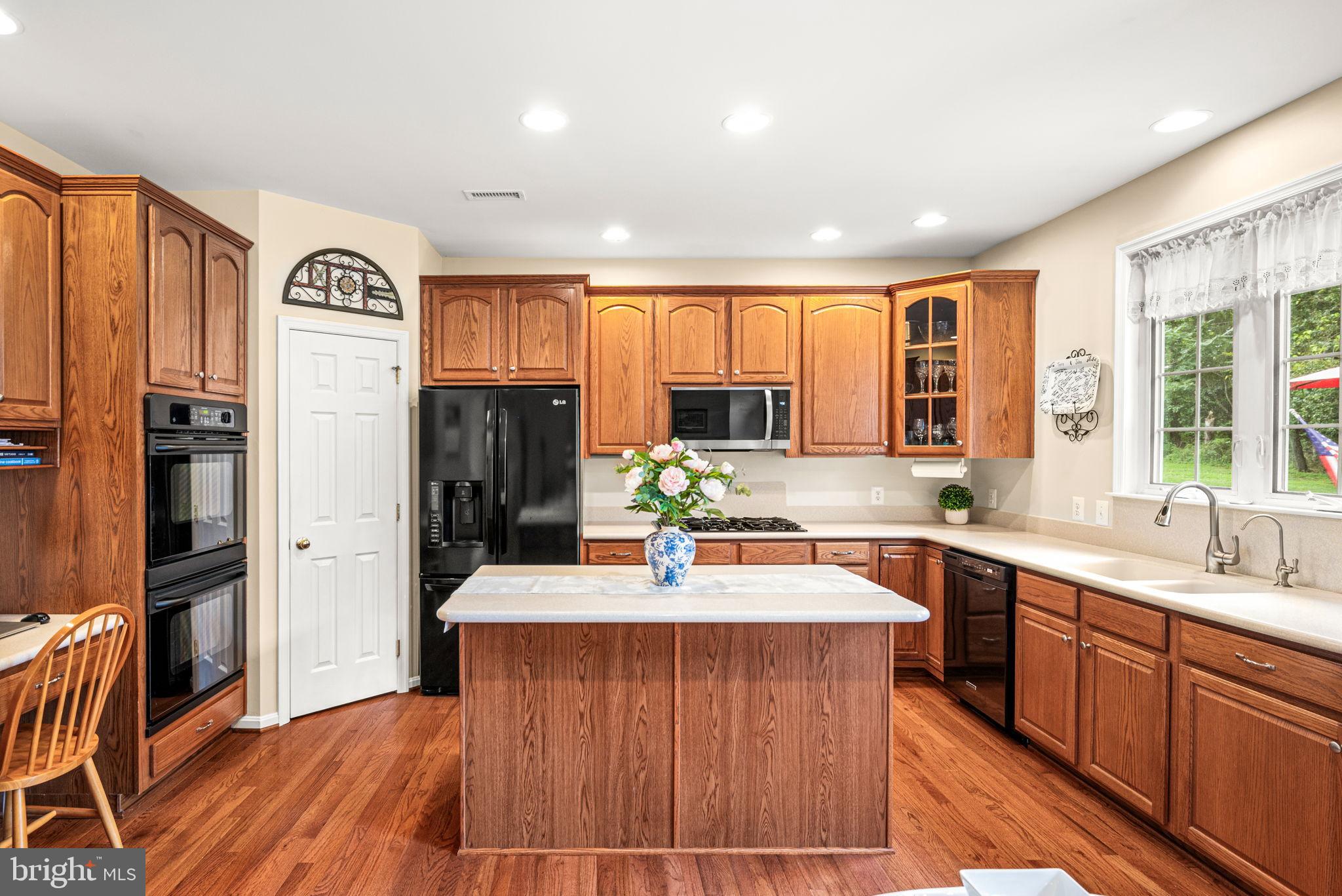 103 Riverside Lane Coatesville, PA 19320 - Photo 17 of 52 Warm, inviting kitchen with rich wood tones.