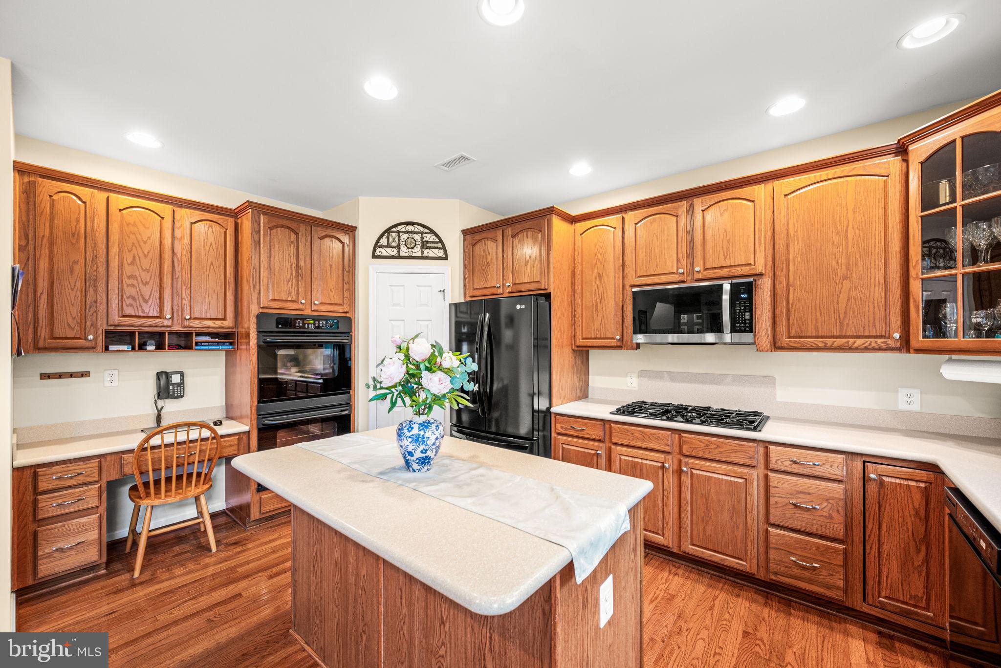 103 Riverside Lane Coatesville, PA 19320 - Photo 18 of 52 Warm and inviting kitchen with rich wood tones.