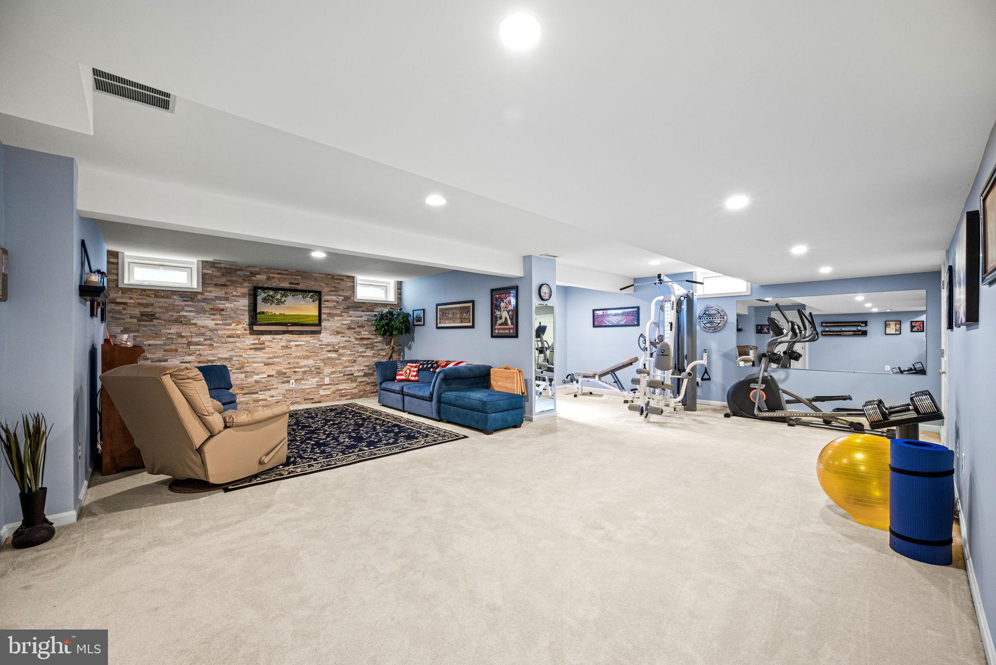 103 Riverside Lane Coatesville, PA 19320 - Photo 34 of 52 Spacious basement retreat with fitness area.