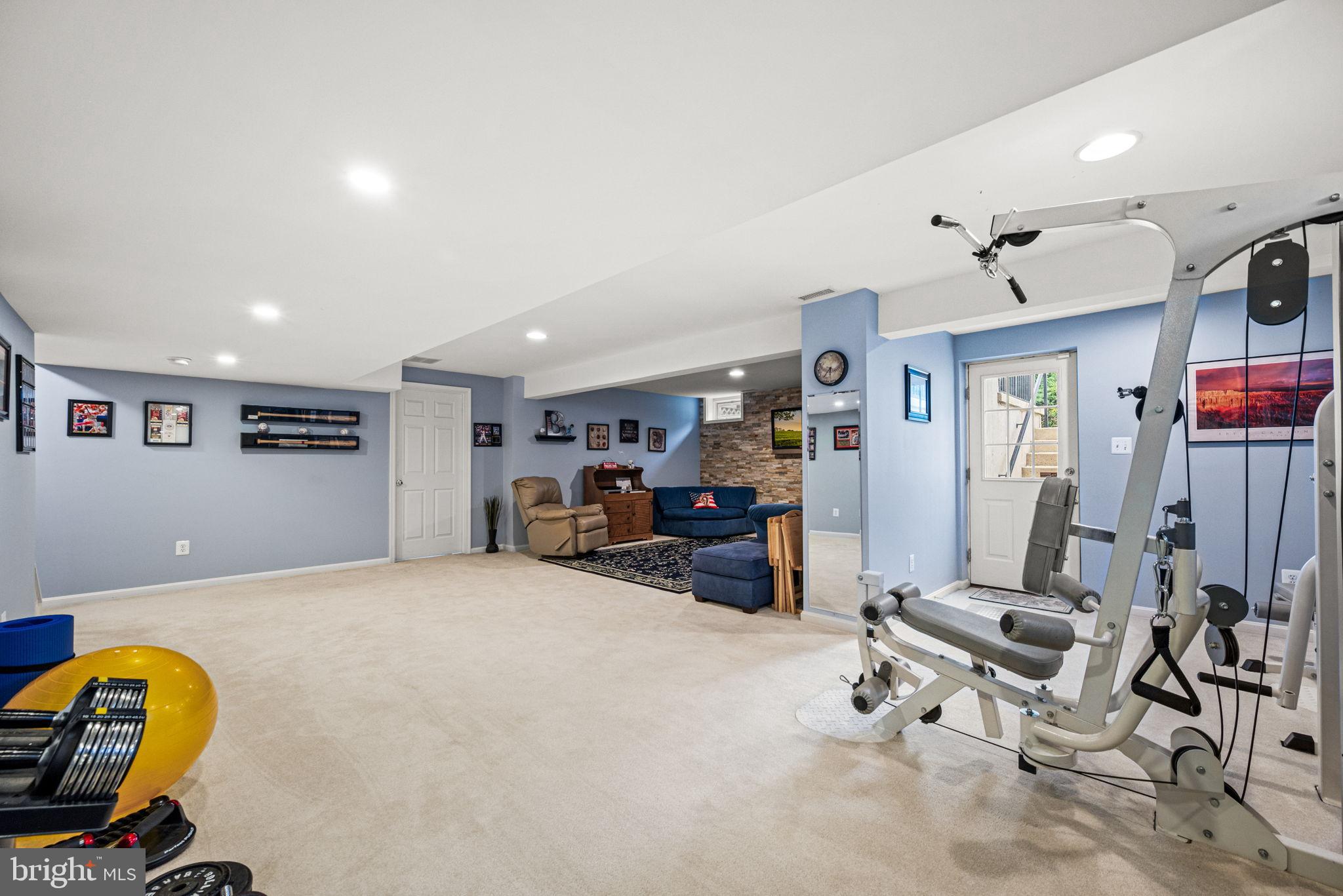 103 Riverside Lane Coatesville, PA 19320 - Photo 36 of 52 Versatile basement gym and relaxation space.