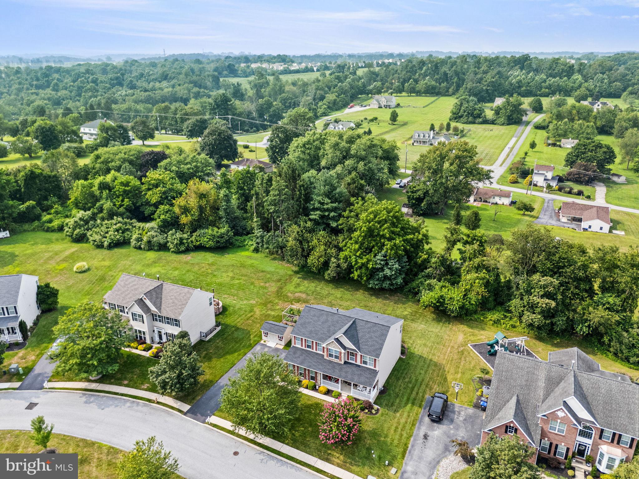 103 Riverside Lane Coatesville, PA 19320 - Photo 47 of 52 Serene suburban landscape with lush greenery.