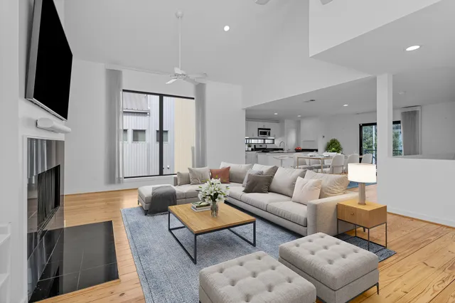 a living room with fireplace furniture and a flat screen tv