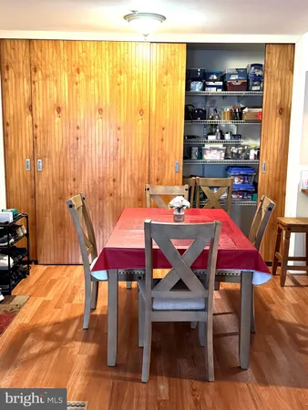 a view of a dining room with furniture and window