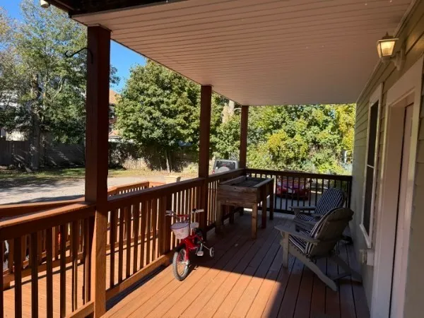 a view of a two chairs with table in balcony