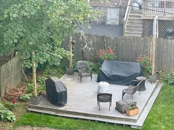 a view of backyard with sitting area