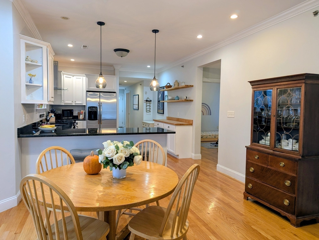 17 Lafield Street, Unit 1 Boston, MA 02122 - Photo 9 of 19 a view of a dining room with furniture window and wooden floor