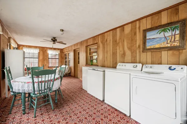 a kitchen with stainless steel appliances granite countertop a sink and a refrigerator