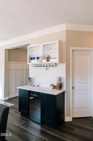 a room with a wooden floor and shoes