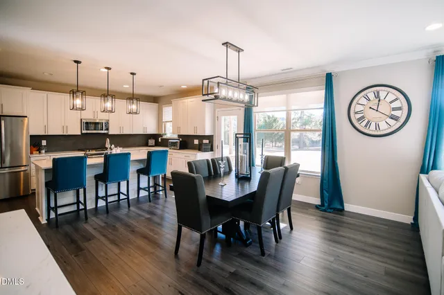 a dining room with furniture window wooden floor