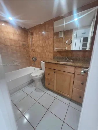 a bathroom with a shower and toilet