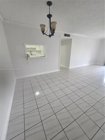 a view of a livingroom with hardwood floor and a ceiling fan