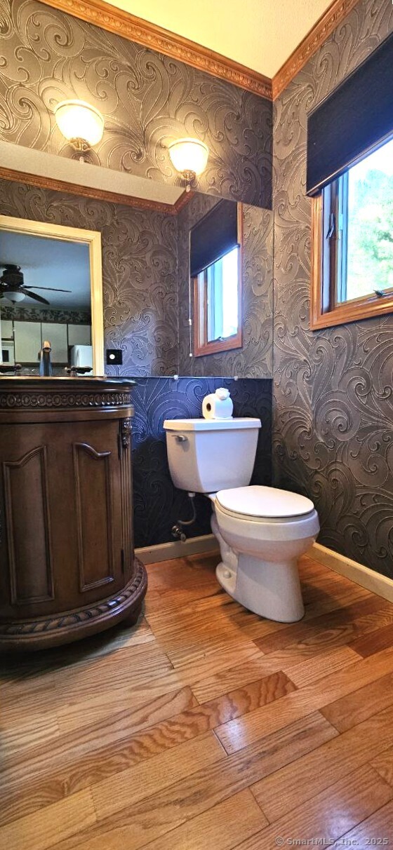 489 Wolcott Street, Unit 47 Bristol, CT 06010 - Photo 17 of 32 a bathroom with a toilet sink and mirror