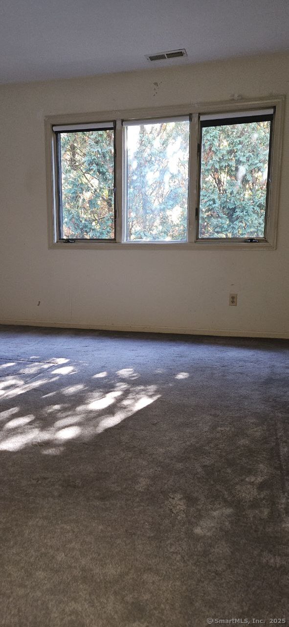 489 Wolcott Street, Unit 47 Bristol, CT 06010 - Photo 24 of 32 an empty room with a window