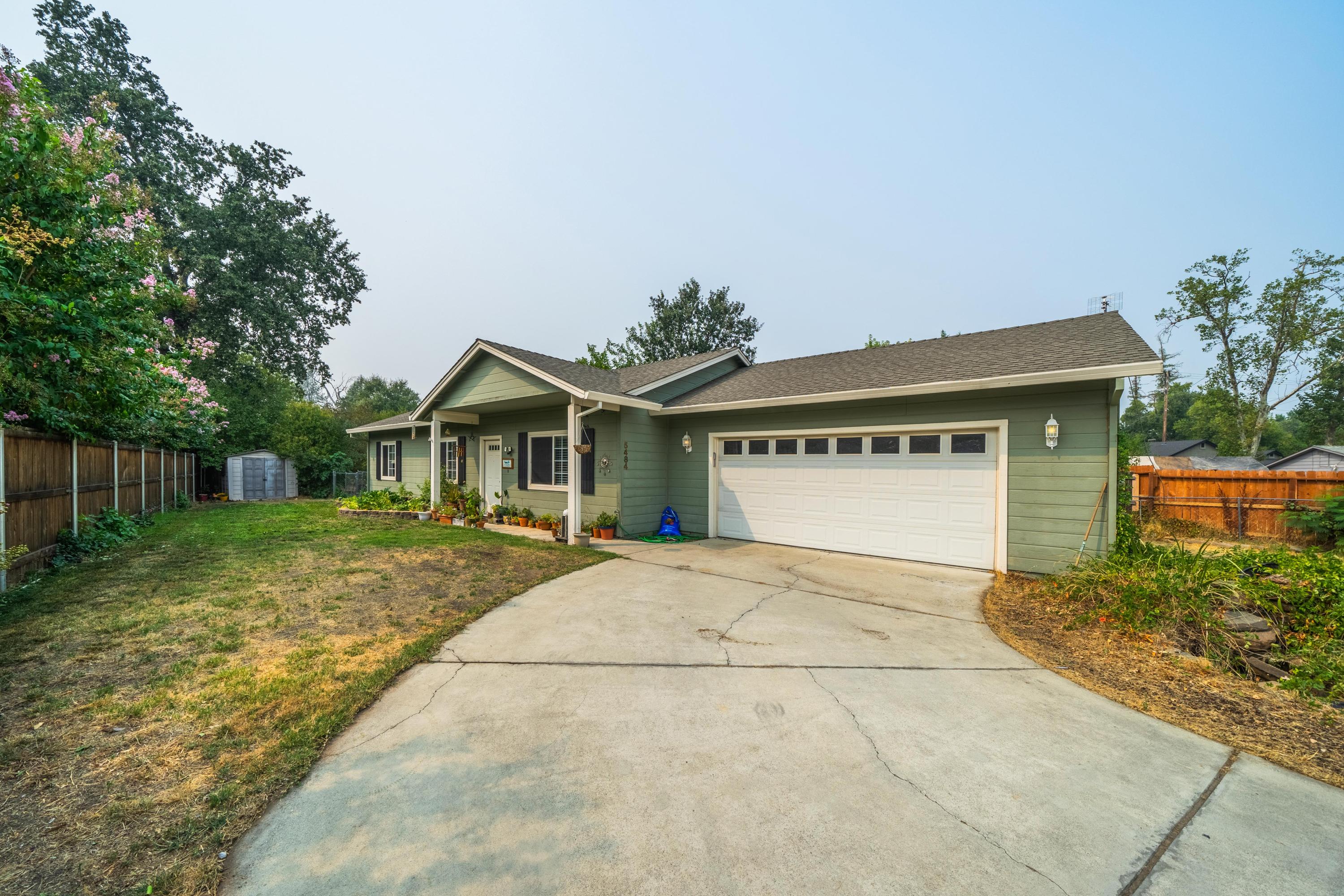 5484 Cedars Road Redding, CA 96001 - Photo 10 of 11 a front view of house with yard and green space