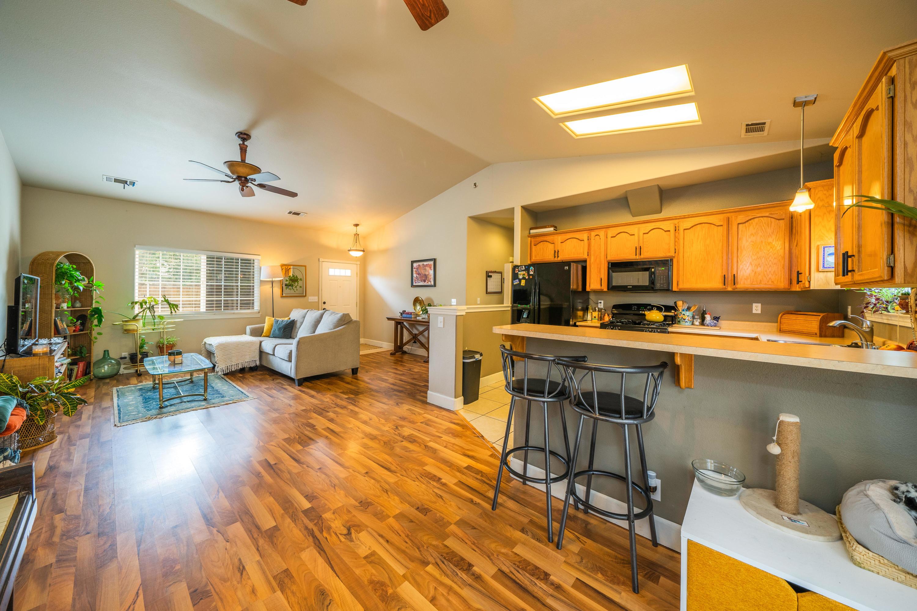 5484 Cedars Road Redding, CA 96001 - Photo 11 of 11 a living room with lots of furniture and kitchen view