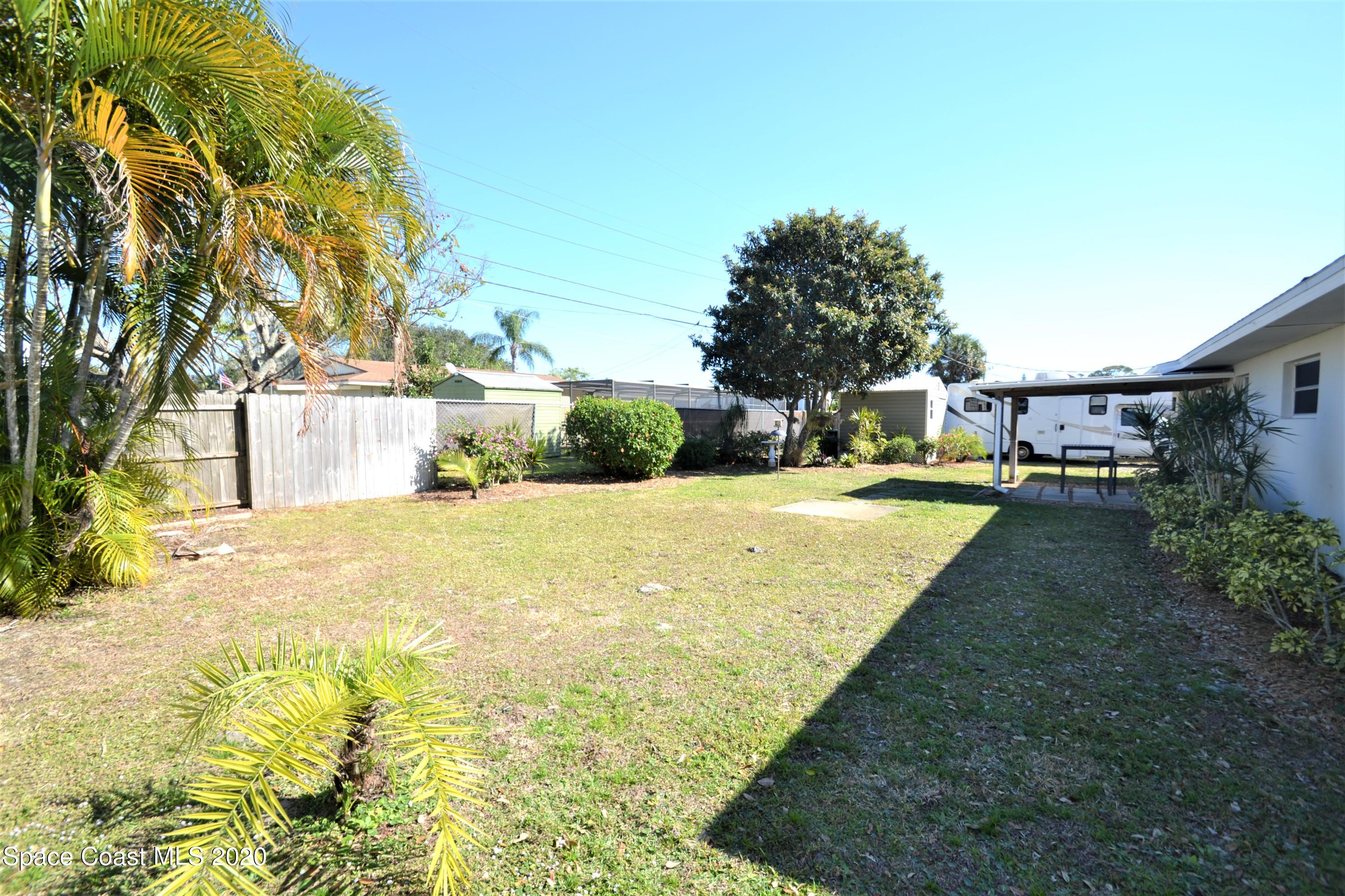 981 Bacon Circle Northeast Palm Bay, FL 32905 - Photo 25 of 26 981 Bacon Cir Backyard (24)