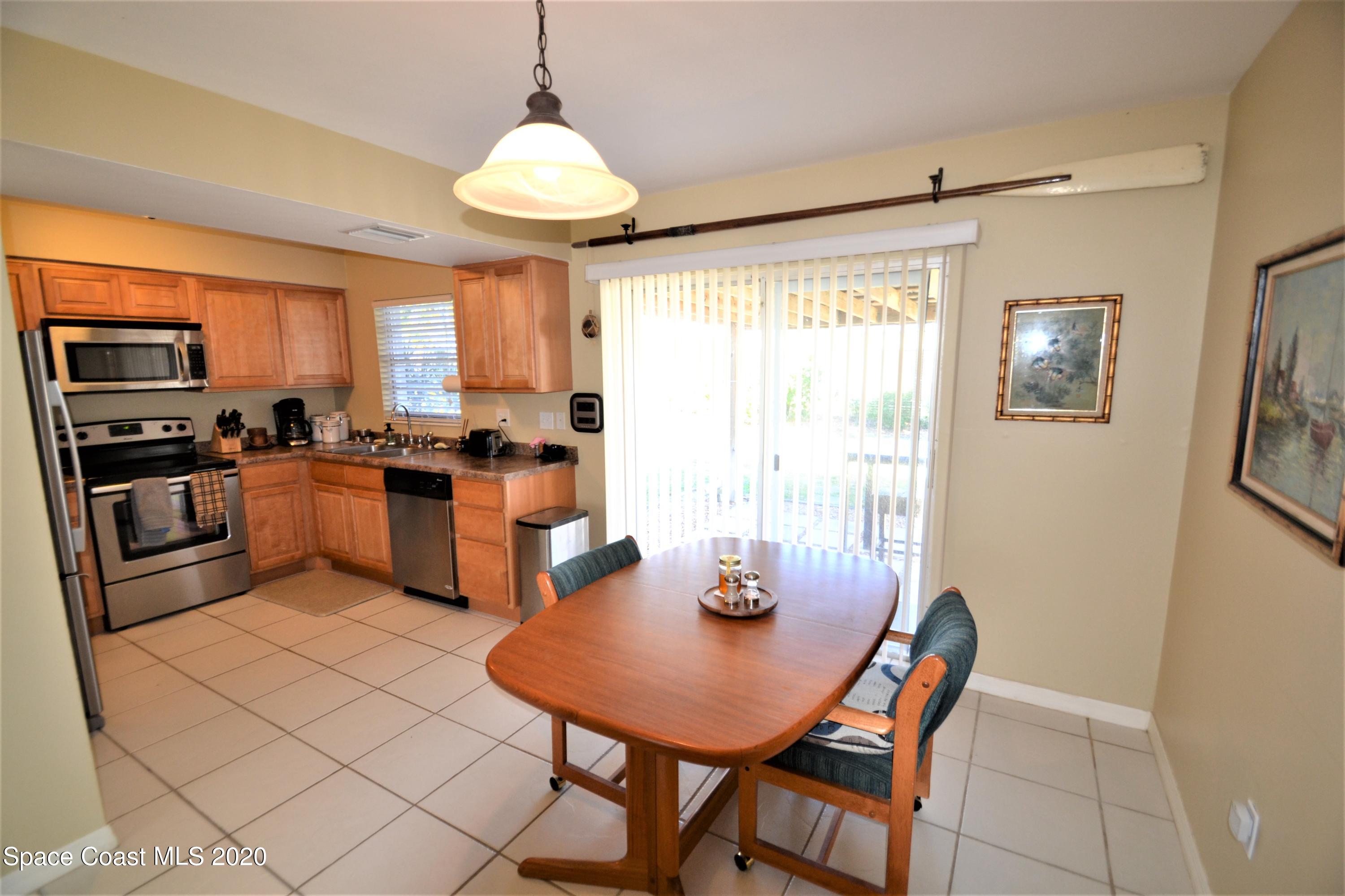 981 Bacon Circle Northeast Palm Bay, FL 32905 - Photo 7 of 26 981 Bacon Cir Dining (5)