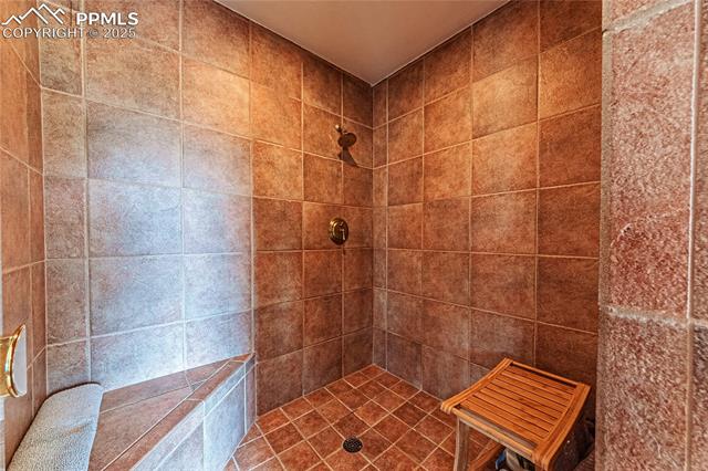 7175 Higher Ridges Court Colorado Springs, CO 80919 - Photo 24 of 50 Bathroom with a tile shower