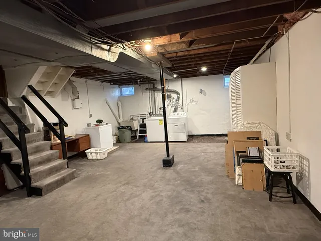 a view of an empty room with stairs