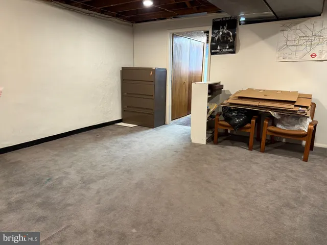 a view of a house with a patio and a yard