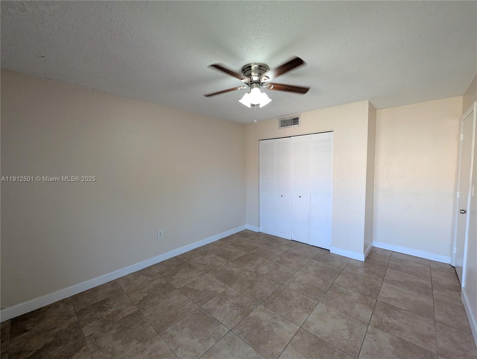 7230 Fairway Drive, Unit F4 Miami Lakes, FL 33014 - Photo 19 of 22 a view of a big room with carpet