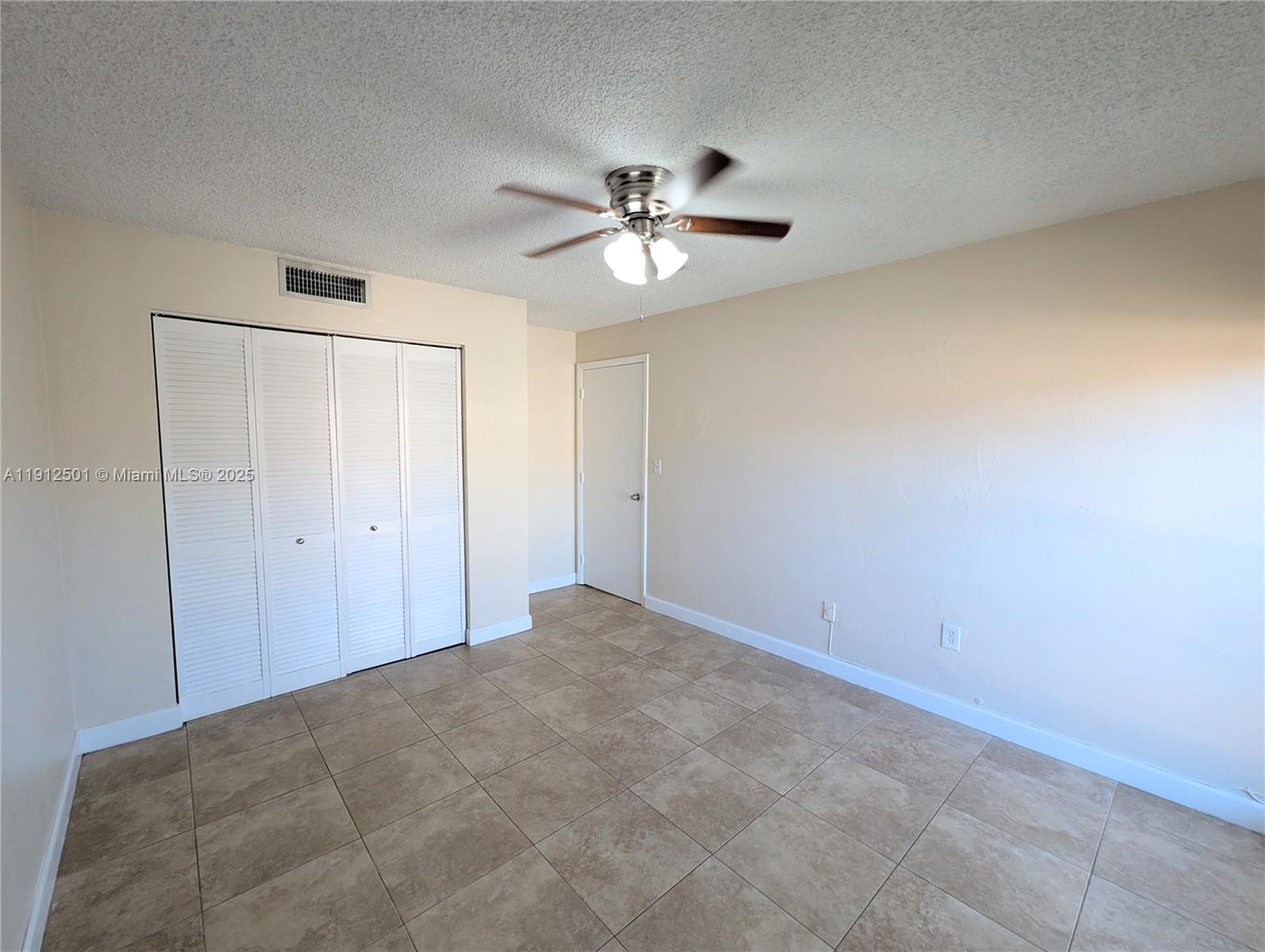 7230 Fairway Drive, Unit F4 Miami Lakes, FL 33014 - Photo 20 of 22 a view of an empty room