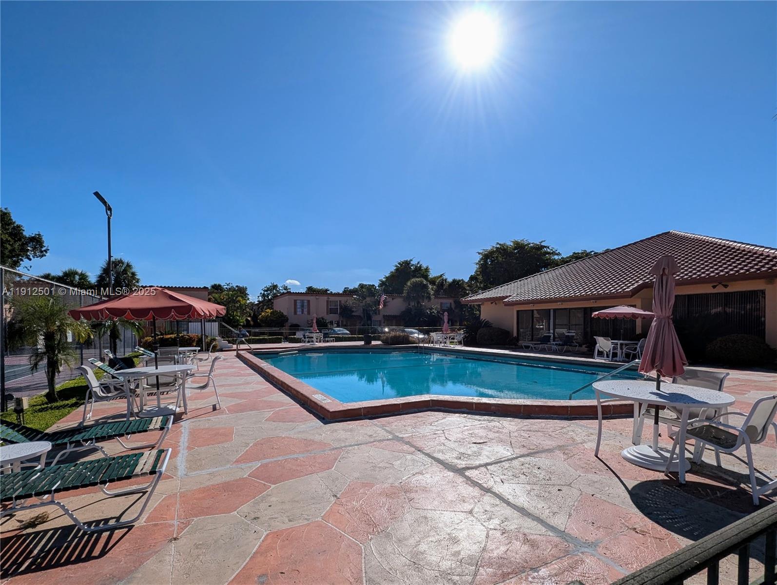 7230 Fairway Drive, Unit F4 Miami Lakes, FL 33014 - Photo 21 of 22 a view of a swimming pool with a patio