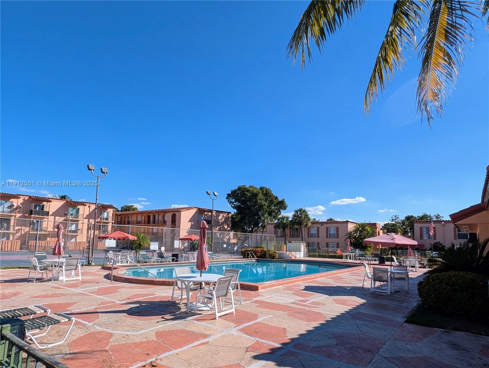 7230 Fairway Drive, Unit F4 Miami Lakes, FL 33014 - Photo 22 of 22 a view of a patio with swimming pool