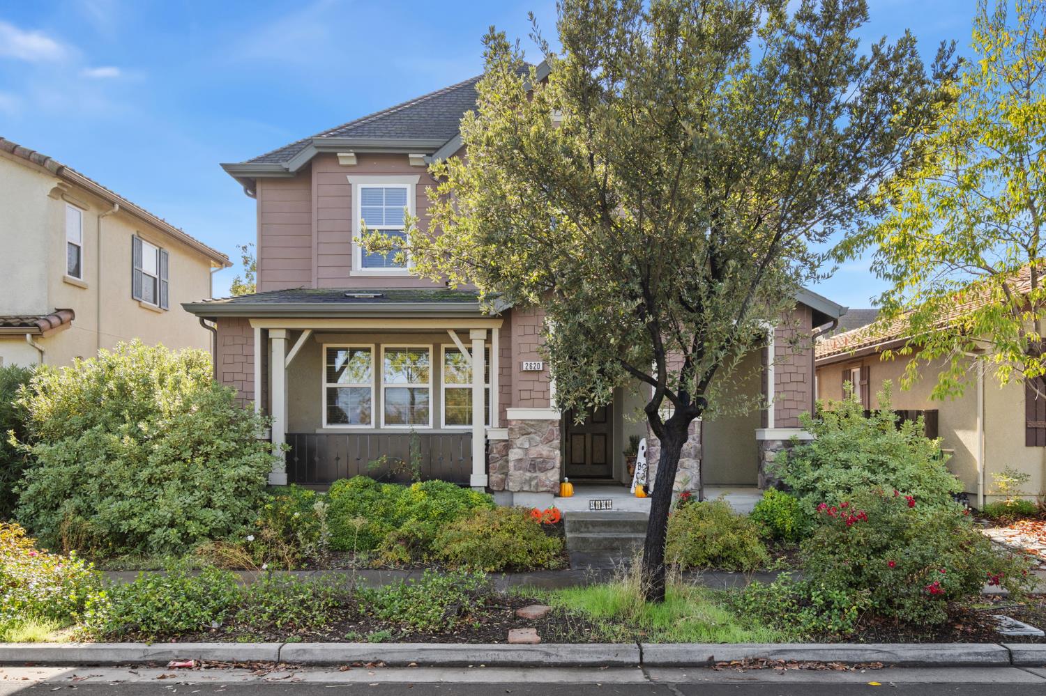 a front view of a house with a yard