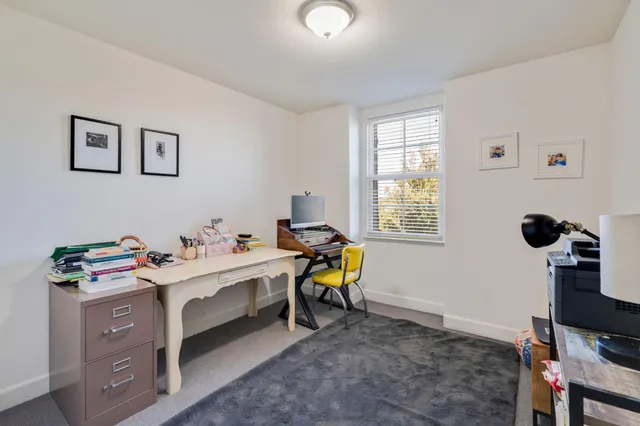 a view of a workspace with furniture