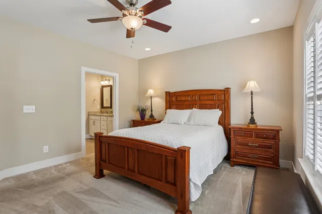 a bathroom with double sink and a mirror