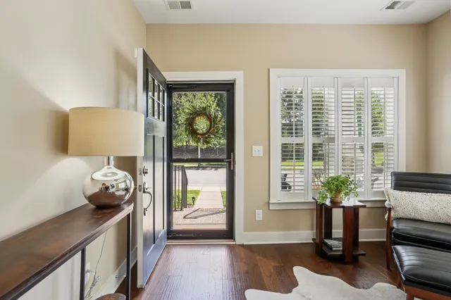 a bedroom with furniture and a potted plant