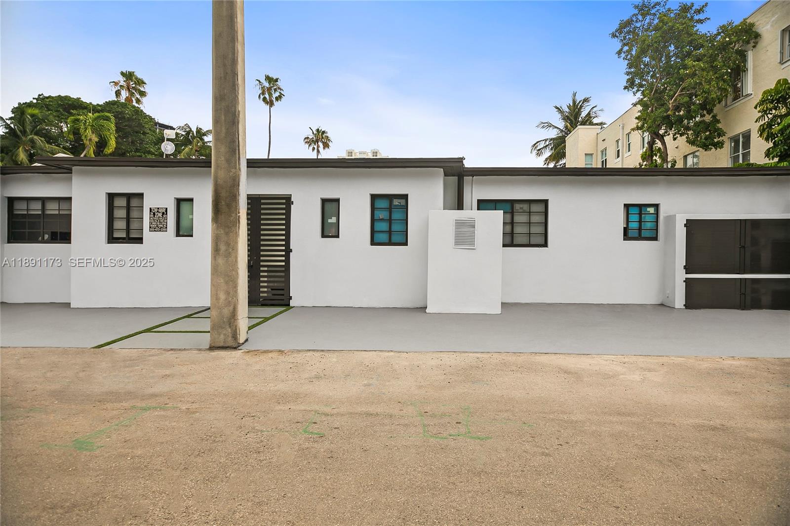 733 Michigan Avenue, Unit 9 Miami Beach, FL 33139 - Photo 13 of 13 a view of a house with a garage