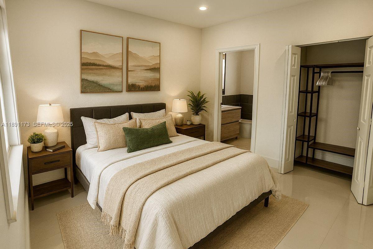 733 Michigan Avenue, Unit 9 Miami Beach, FL 33139 - Photo 6 of 13 a bedroom with a bed and a painting on the wall