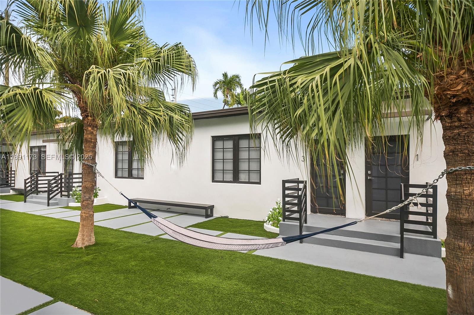 733 Michigan Avenue, Unit 9 Miami Beach, FL 33139 - Photo 10 of 13 a front view of a house with garden