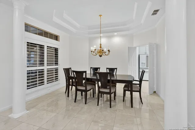 a dining room with furniture and window