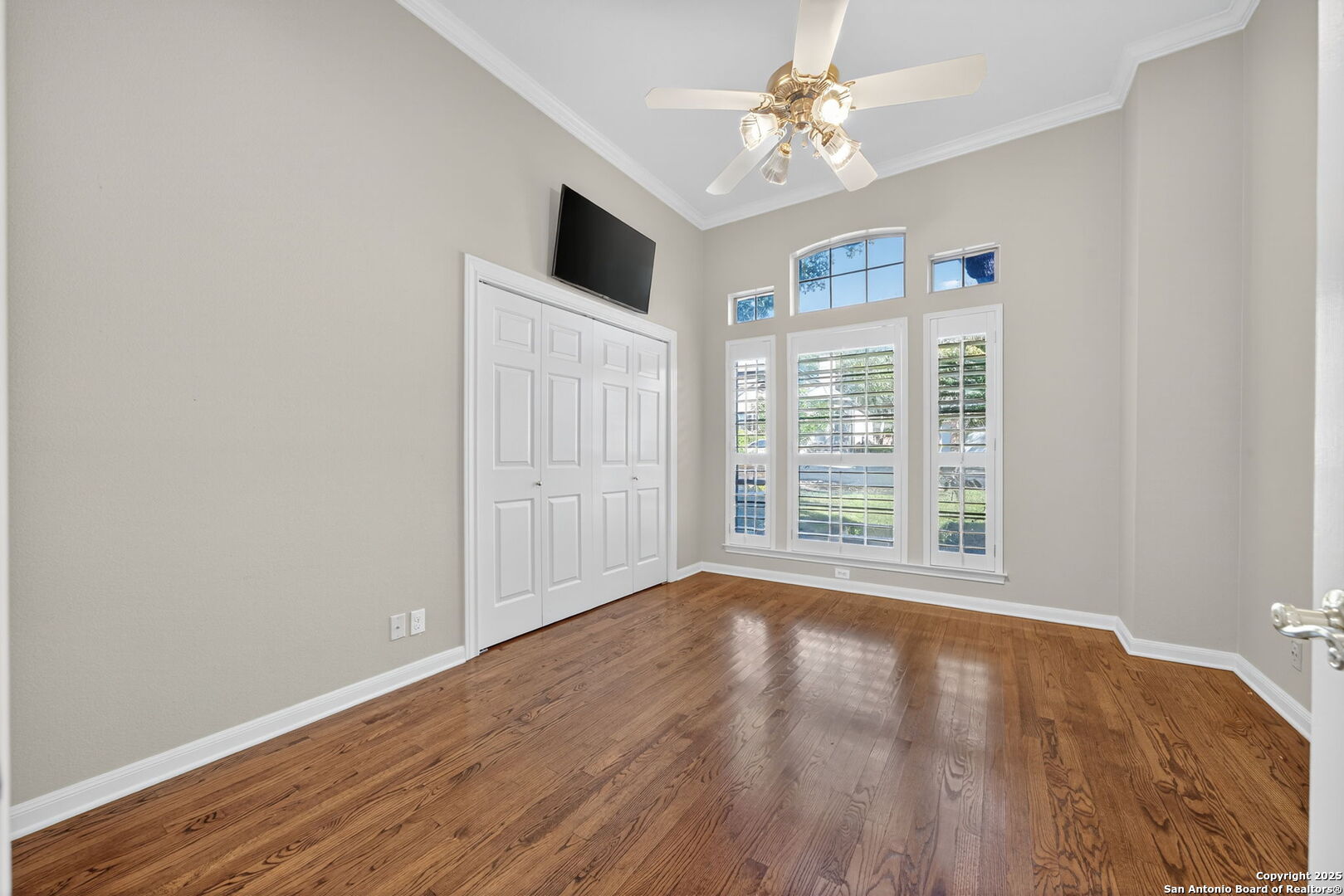 6 Regent Arms San Antonio, TX 78257 - Photo 17 of 29 a view of an empty room with wooden floor and a window