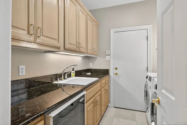 a kitchen with a sink and cabinets