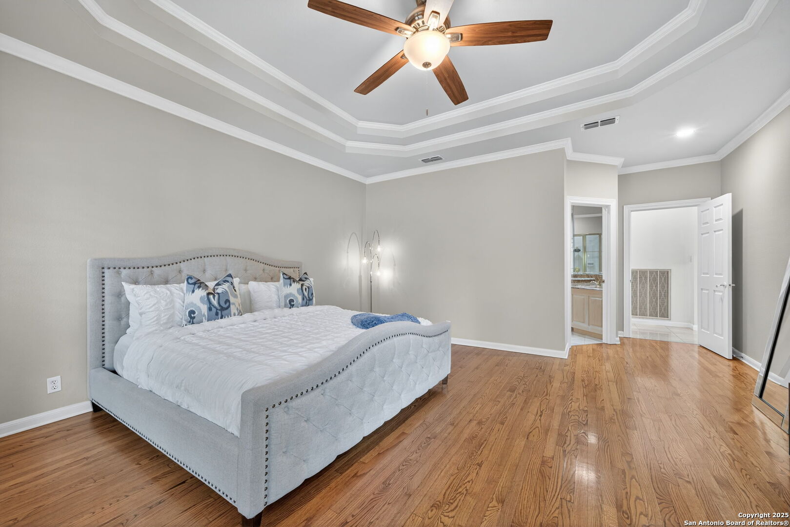 6 Regent Arms San Antonio, TX 78257 - Photo 5 of 29 a bedroom with a bed and a ceiling fan