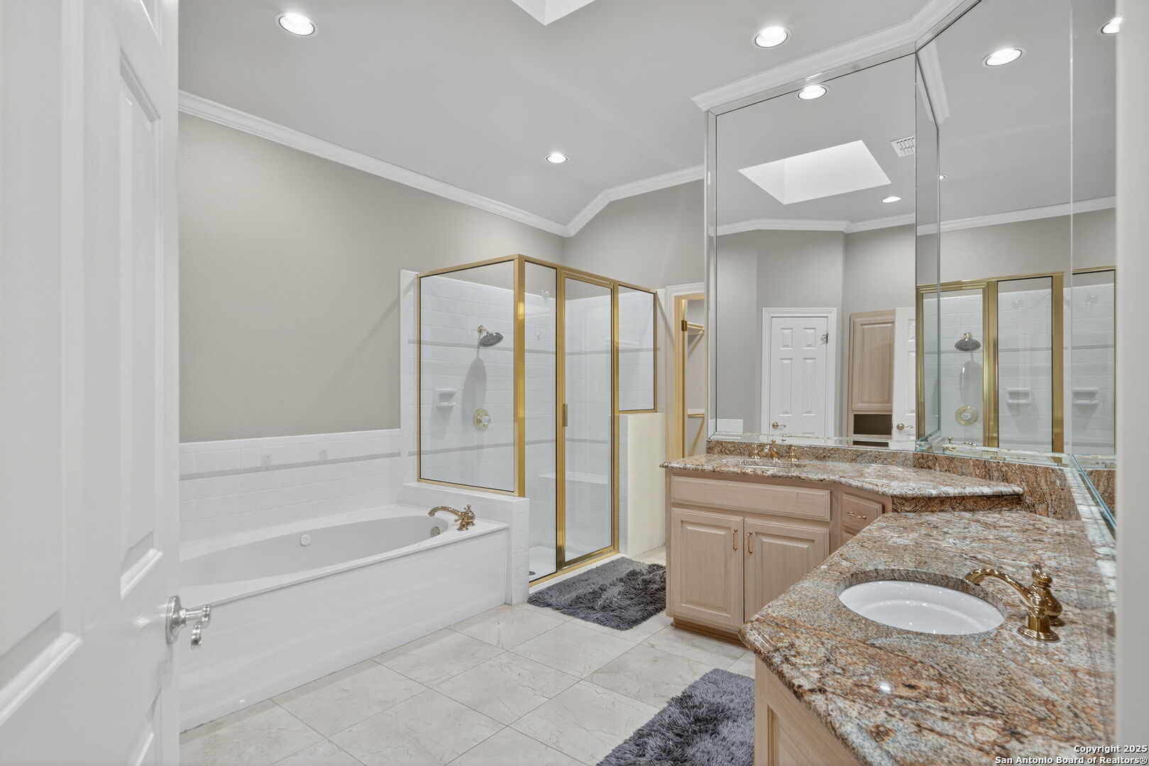 6 Regent Arms San Antonio, TX 78257 - Photo 6 of 29 a spacious bathroom with a granite countertop tub sink and mirror