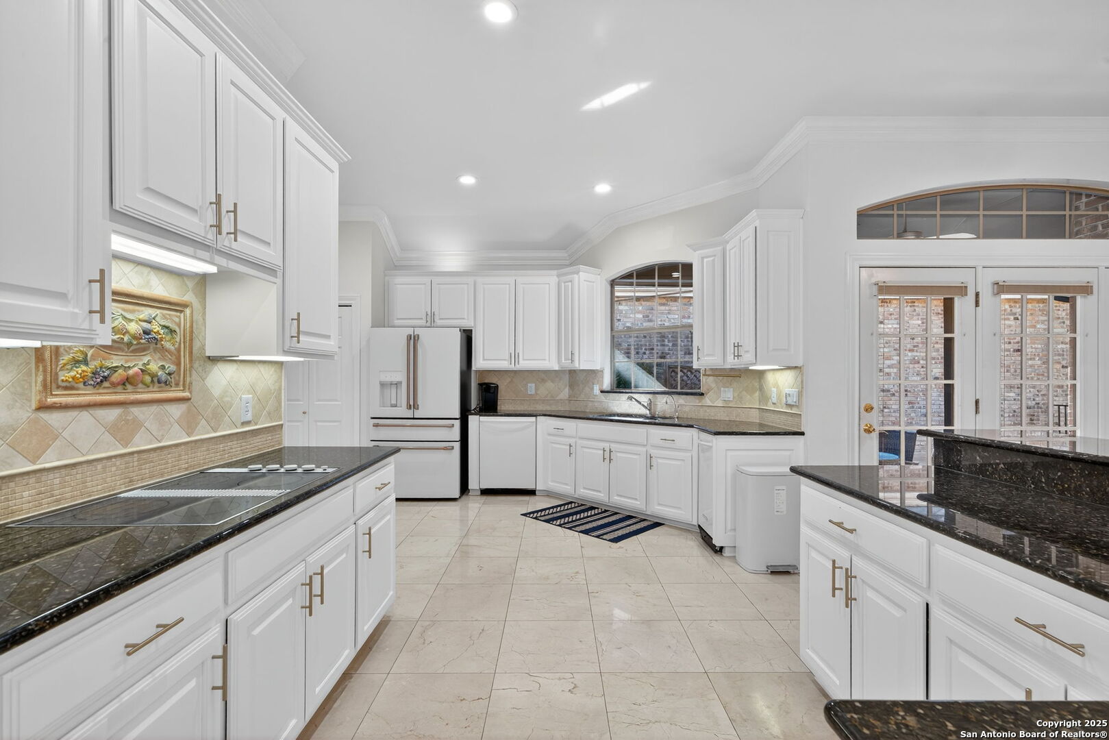6 Regent Arms San Antonio, TX 78257 - Photo 10 of 29 a kitchen with stainless steel appliances granite countertop a sink and cabinets