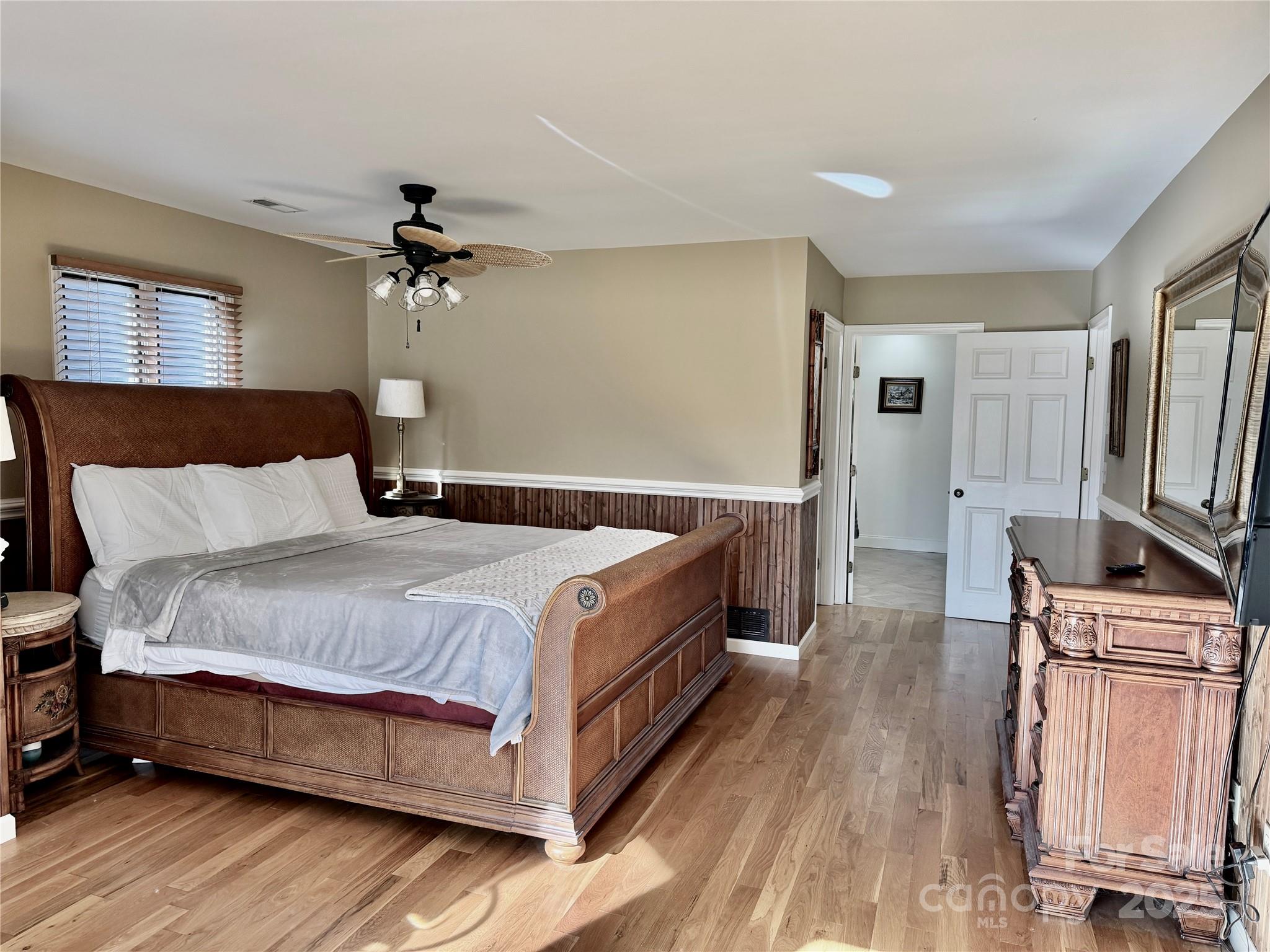111 Burning Tree Lane, Unit C601 Flat Rock, NC 28731 - Photo 15 of 32 a spacious bedroom with a bed and a flat screen tv