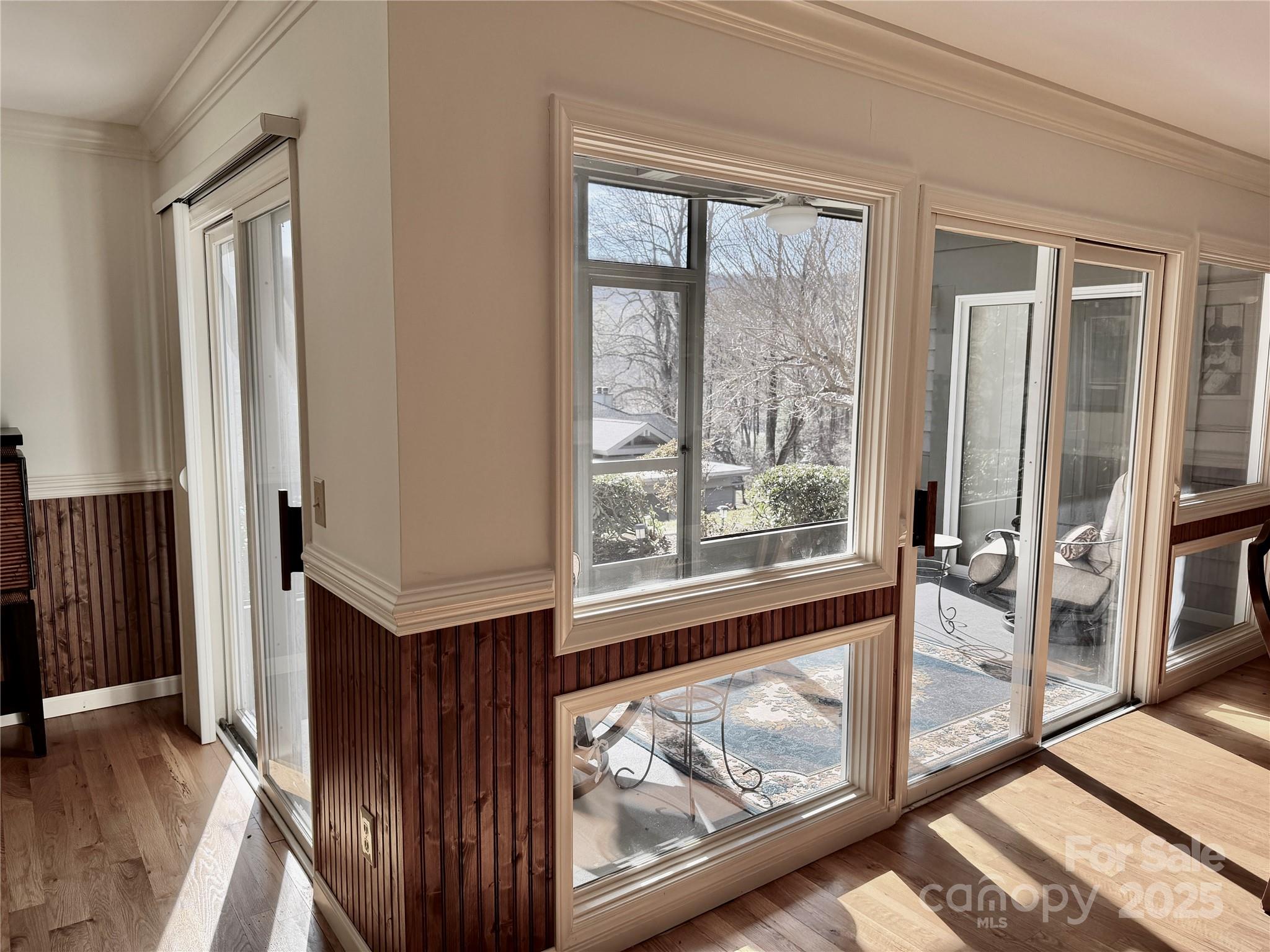 111 Burning Tree Lane, Unit C601 Flat Rock, NC 28731 - Photo 2 of 32 a view of a hallway with wooden floor and staircase