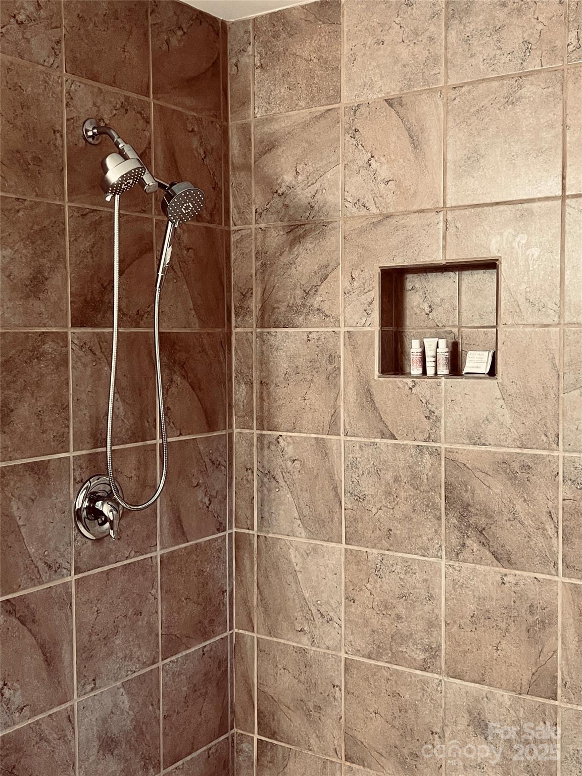 111 Burning Tree Lane, Unit C601 Flat Rock, NC 28731 - Photo 21 of 32 a bathroom with a shower