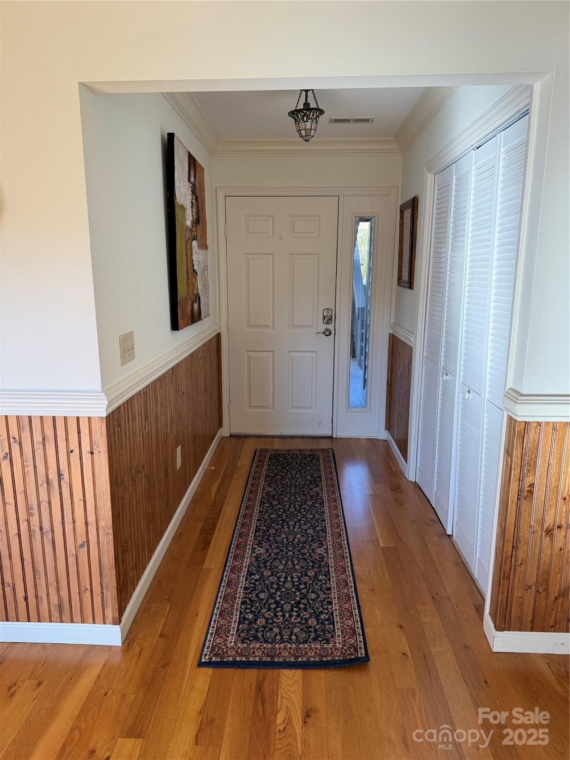 111 Burning Tree Lane, Unit C601 Flat Rock, NC 28731 - Photo 3 of 32 a view of hallway with wooden floor and stairs