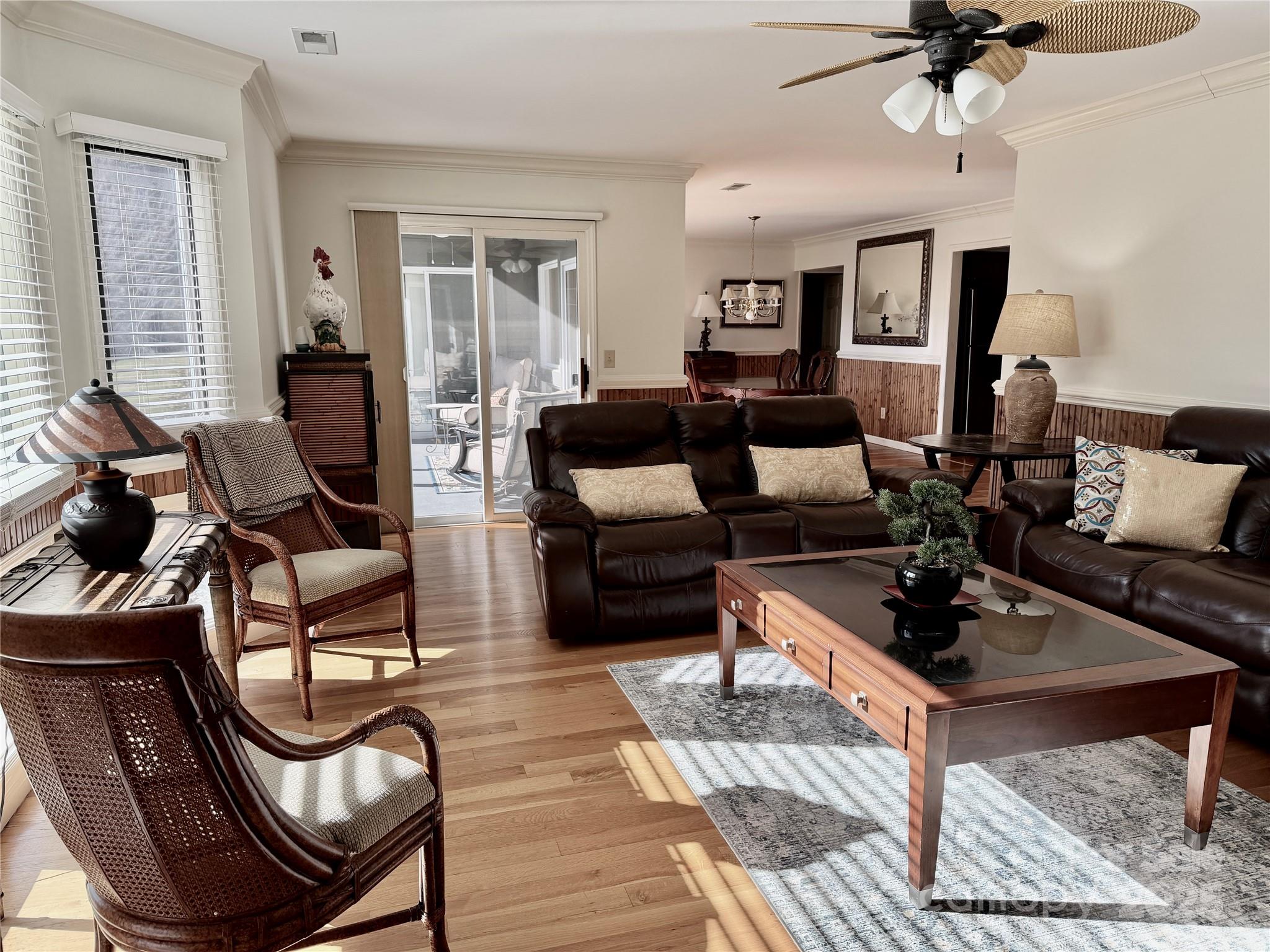 111 Burning Tree Lane, Unit C601 Flat Rock, NC 28731 - Photo 7 of 32 a living room with furniture a window and a chandelier