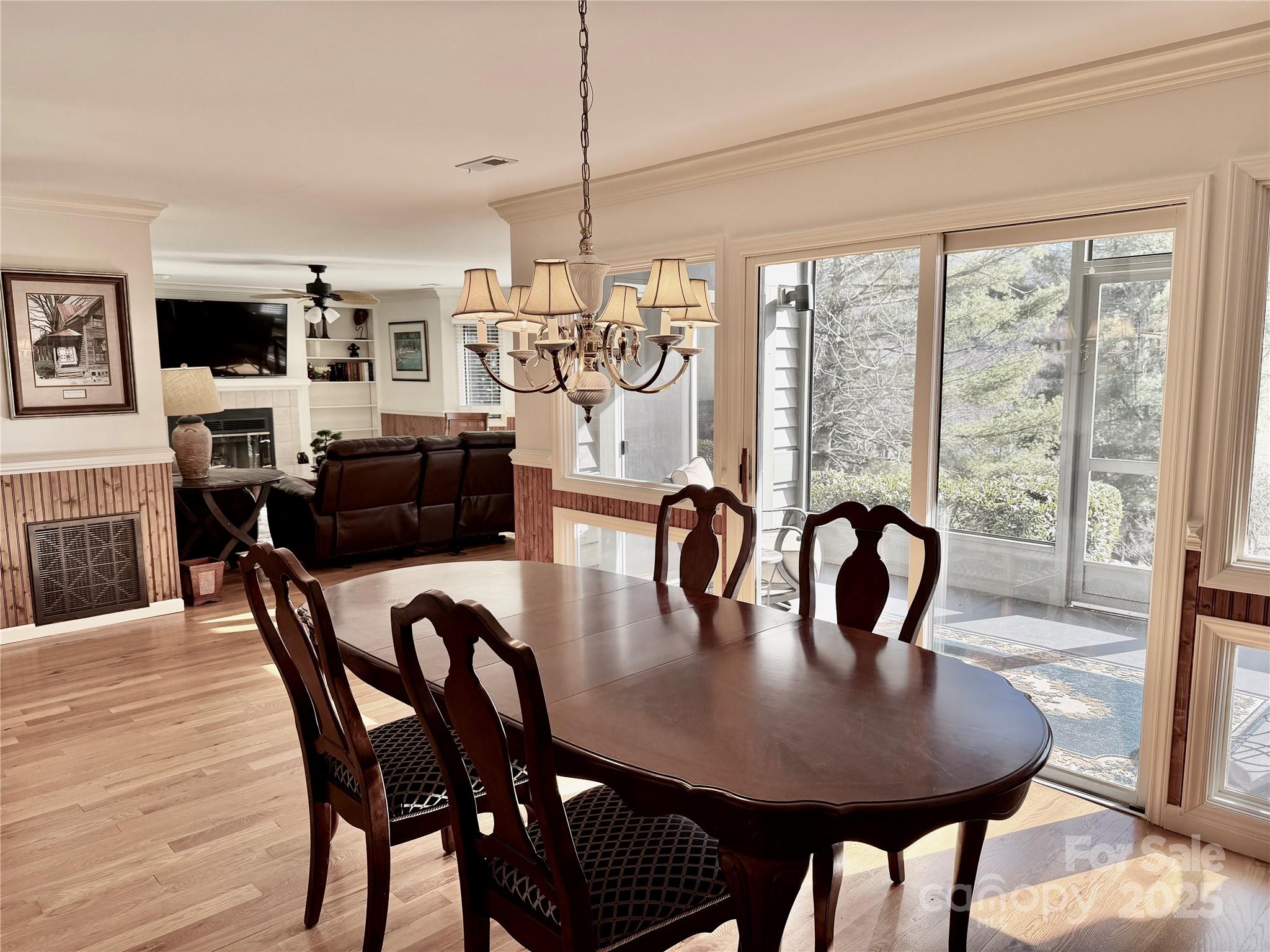 111 Burning Tree Lane, Unit C601 Flat Rock, NC 28731 - Photo 8 of 32 a view of a dining room with furniture window and wooden floor