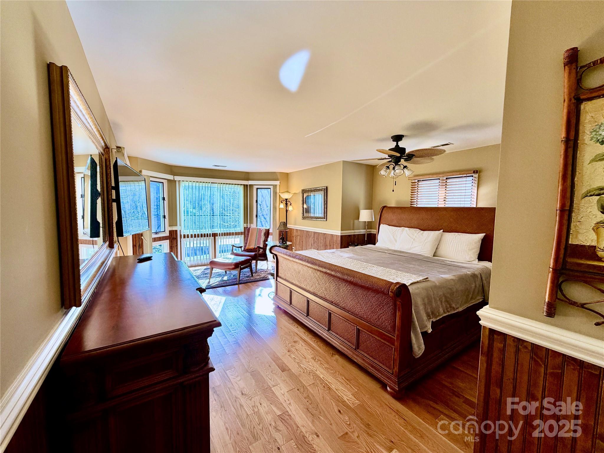 111 Burning Tree Lane, Unit C601 Flat Rock, NC 28731 - Photo 10 of 32 a bedroom with a bed and wooden floor