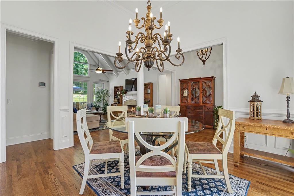 537 Old Collins Road Hoschton, GA 30548 - Photo 7 of 42 a view of a dining room with furniture and chandelier