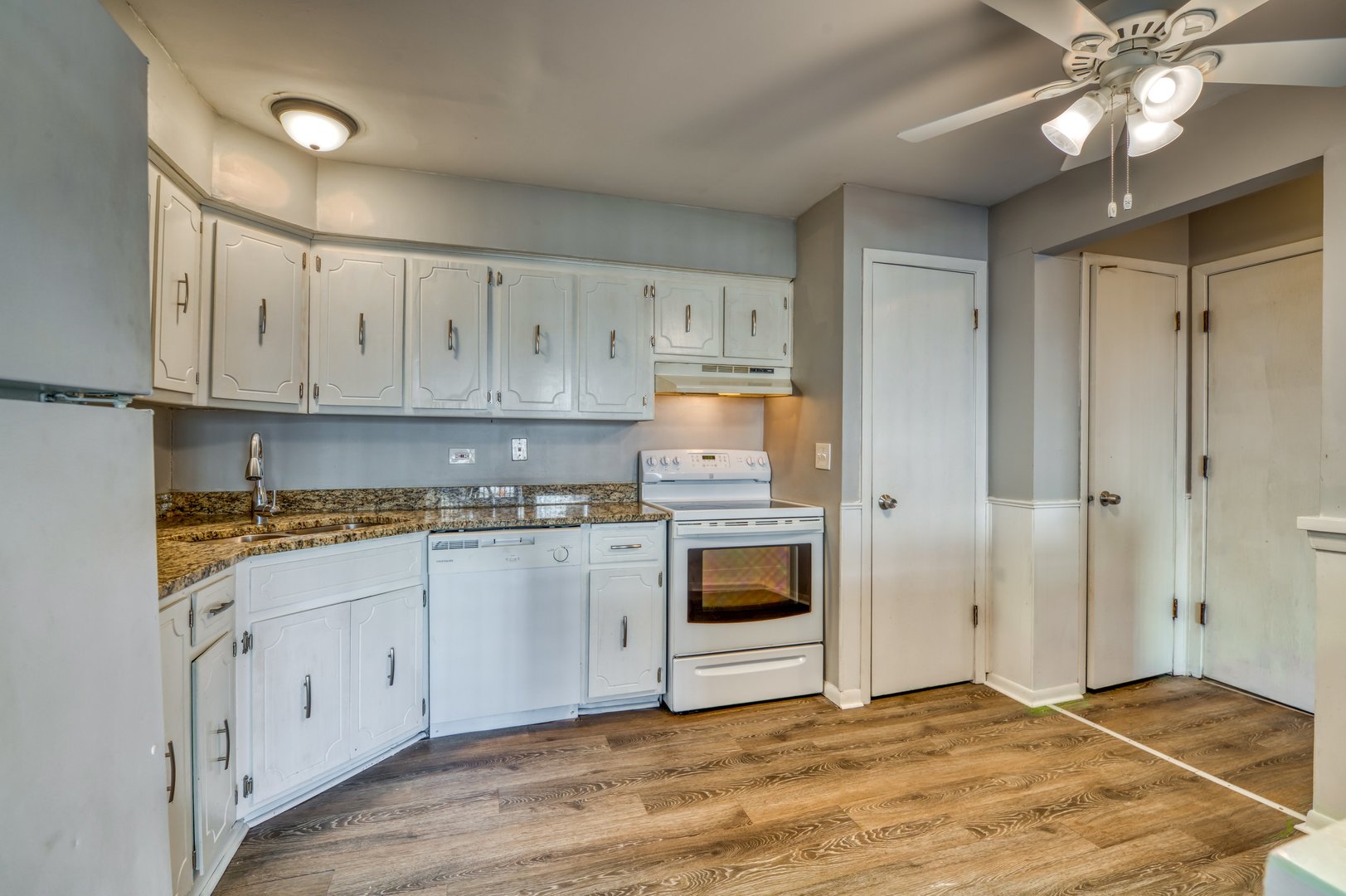 1713 Nelson Road, Unit 2 New Lenox, IL 60451 - Photo 6 of 10 a kitchen with stainless steel appliances granite countertop a stove a sink and a refrigerator
